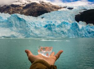 Hand showing a piece of ice from rthe spegazzini glacier in Argentina. The glaciers national Park in Patagonia